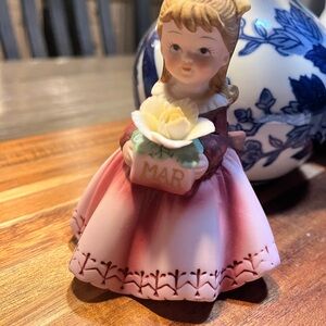 Charming Figurine with Pink Dress and Yellow Flower